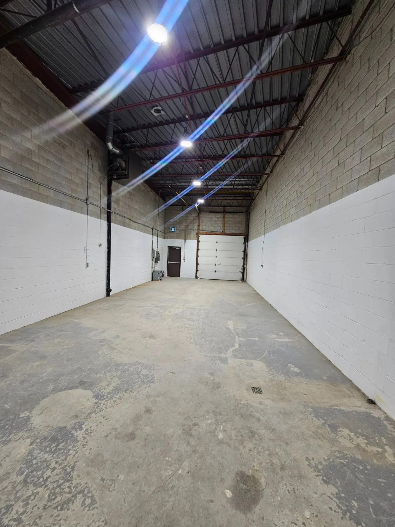 Finished warehouse bay: painted block walls and sealed concrete floor