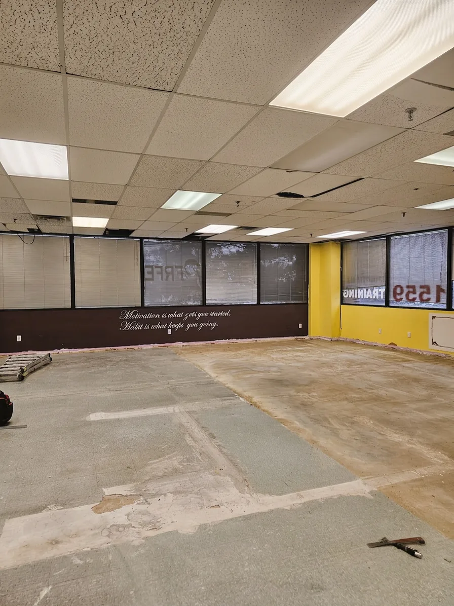 1050 Finch before: former fitness studio with flooring removed
