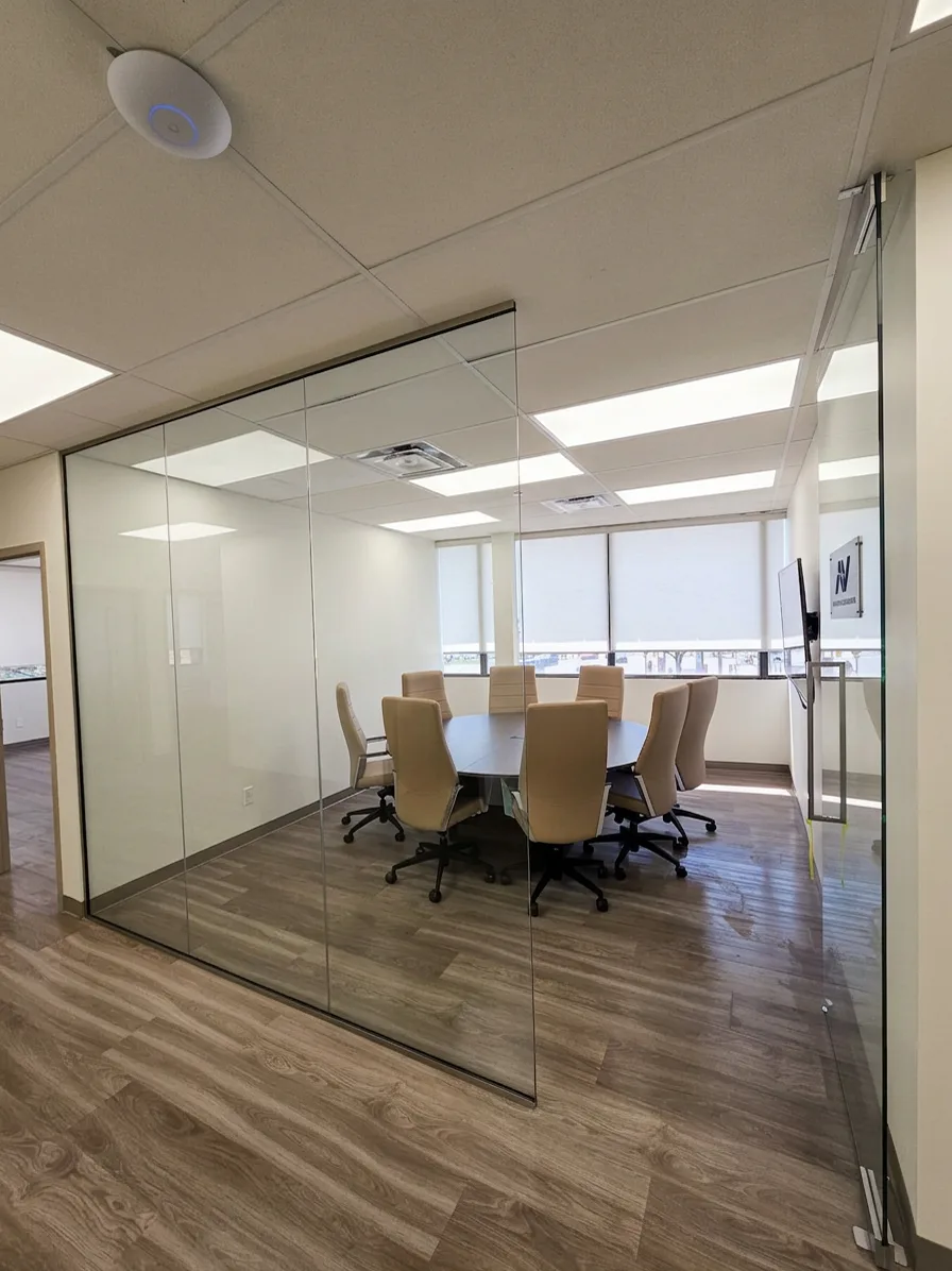 1050 Finch after: finished glass-walled boardroom