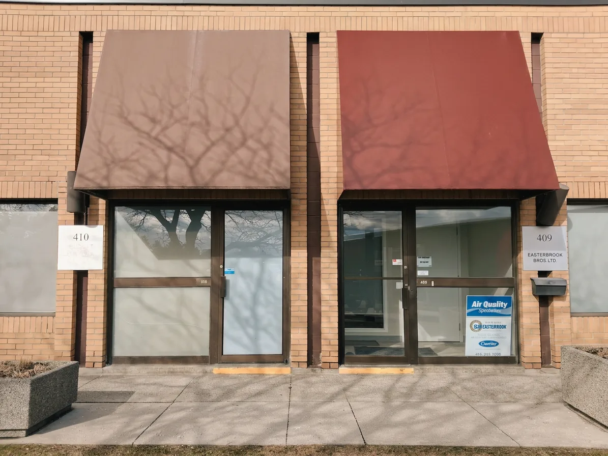 Refinished storefront canopies on a commercial plaza